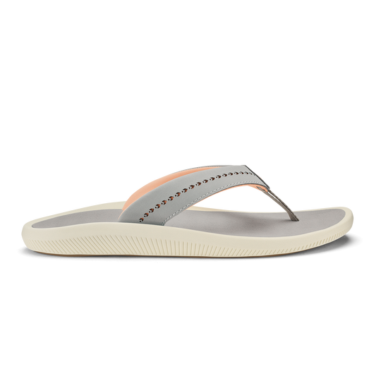 Ash-colored thong sandal with peach accent stripe, studded strap detail, and cream-colored ridged sole.