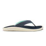 Trench blue thong sandal with mint green strap detail and cream-colored textured sole.