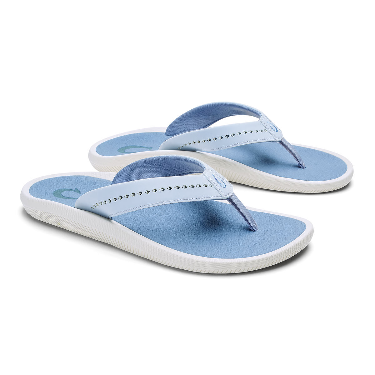 Pair of blue and white thong sandals with studded straps and cushioned soles.
