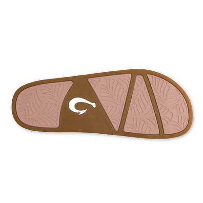 Sandal sole with soft pink panels and warm sand brown border, featuring geometric tread pattern and white brand logo.