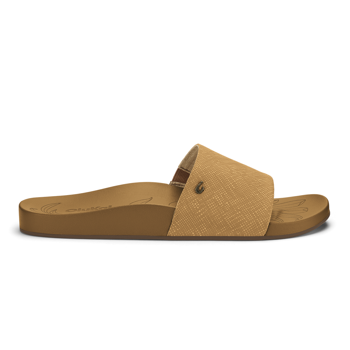 Tan slide sandal with textured crosshatch upper and solid sole featuring decorative line detailing.