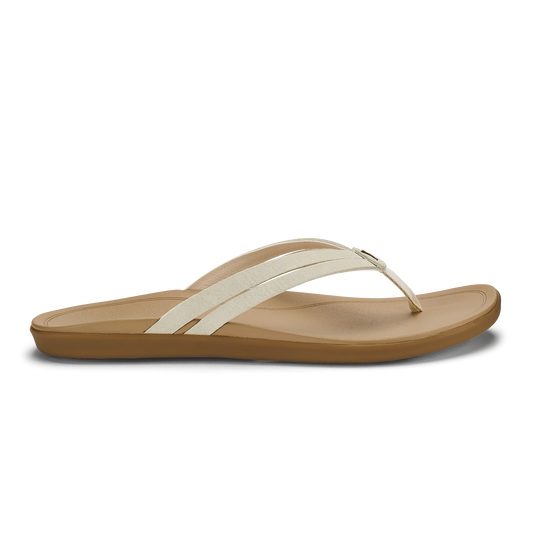 Tan and cream flip-flop sandal with curved footbed and thong strap.