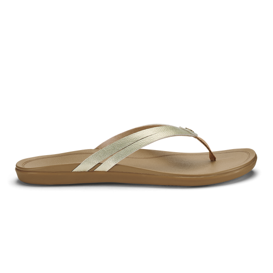 Tan flip-flop sandal with metallic gold straps crossing over the foot bed.
