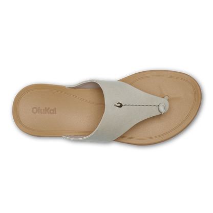 Tan and cream thong sandal with rounded footbed and beaded toe post detail, viewed from above.