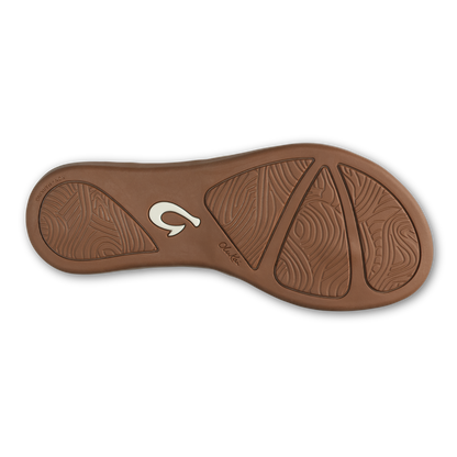 Toffee-colored sandal sole with textured tread pattern and white logo detail.