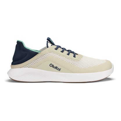 Olukai Kialoa running shoe in cream with white sole, navy heel counter, and dark blue laces.