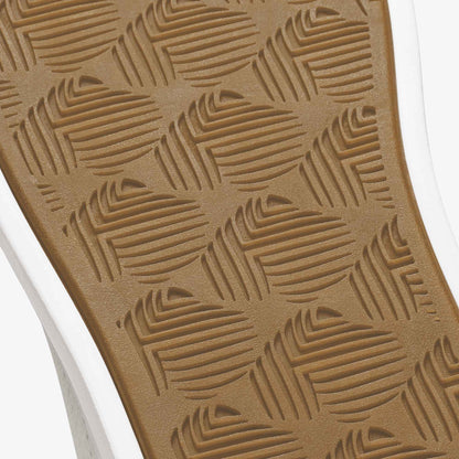 Tan rubber sole with geometric linear pattern and white midsole stripe.