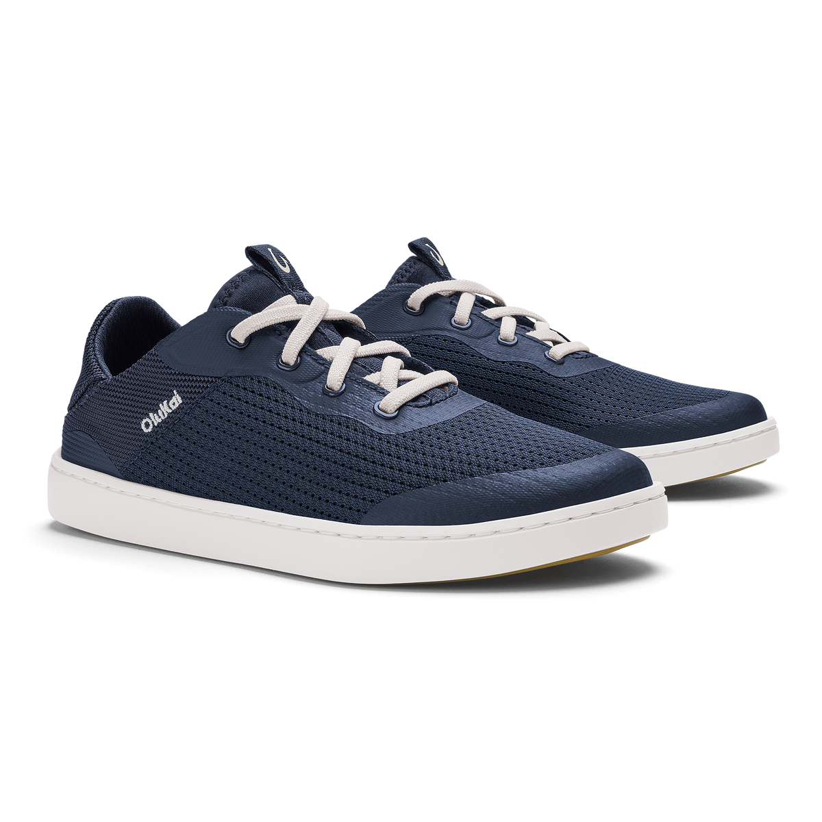 Pair of dark blue lace-up sneakers with white soles and cream-colored laces.