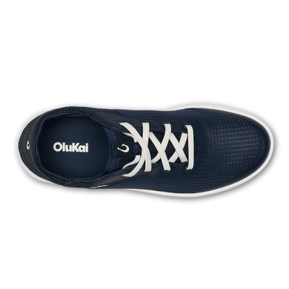 Dark blue OluKai sneaker with white laces and white sole, shown from above.