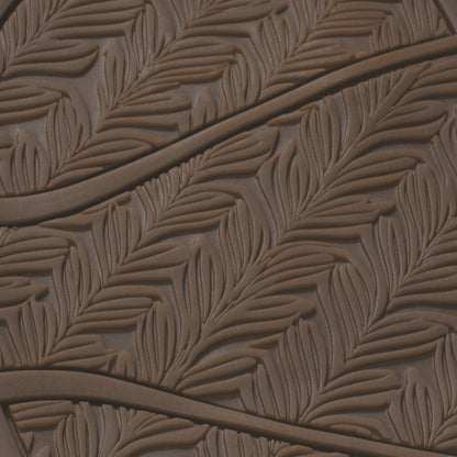 Warm sand-colored sole with embossed leaf pattern and curved ridges.