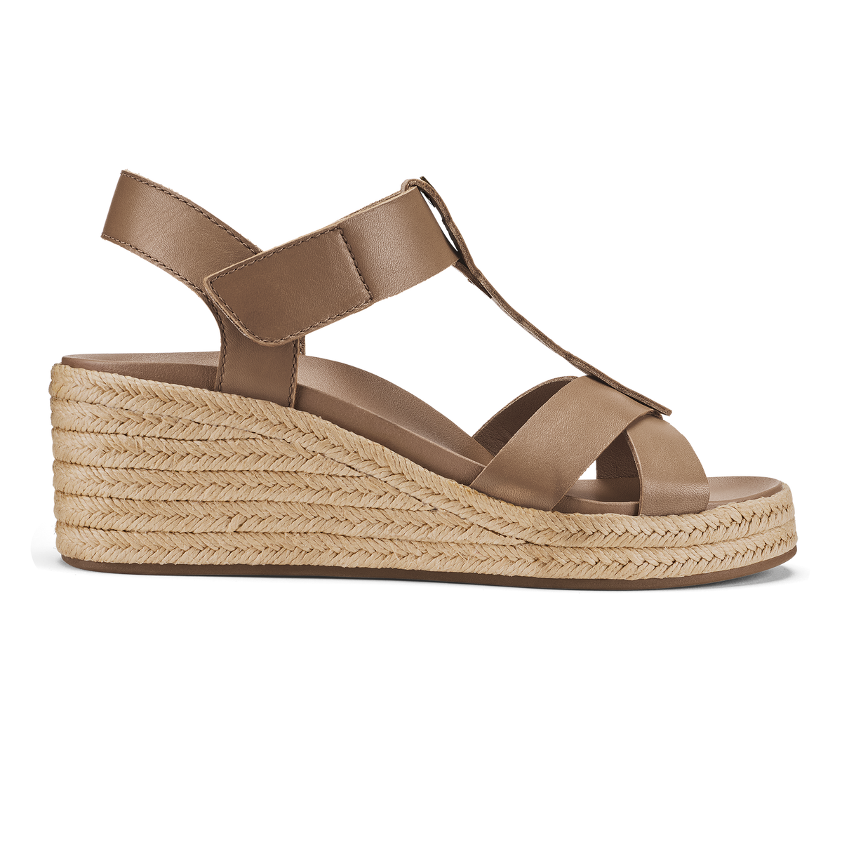 Tan leather wedge sandal with crossed straps, ankle strap, and woven espadrille sole.