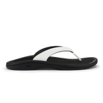 Black and white thong sandal with curved footbed and contrasting strap design.