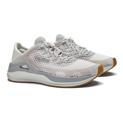 White and gray athletic running shoe with tan heel accent and mesh upper.