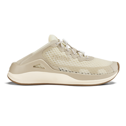 Beige mule-style athletic shoe with mesh upper, lace detail, cream midsole, and gum rubber sole.