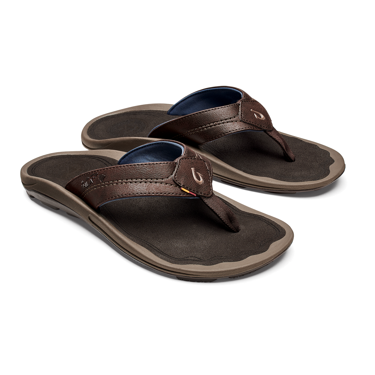 Pair of brown leather flip-flop sandals with dark footbeds, navy blue insoles, and tan rubber soles.