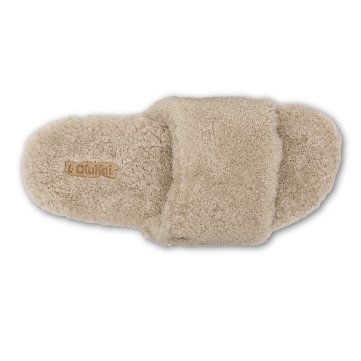 Tan fleece slipper with textured cushioned sole and OluKai branding on insole, shown from top view.
